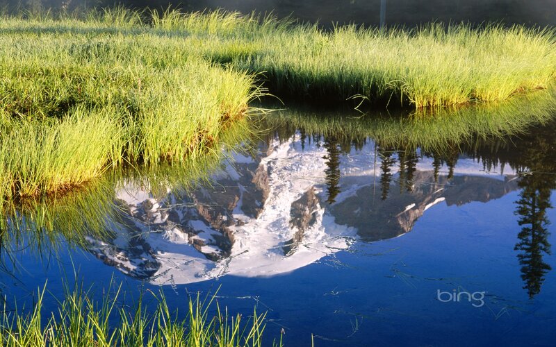 Mountain reflection in a calm pond