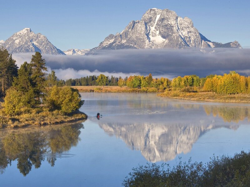 Mountain reflection in a calm river