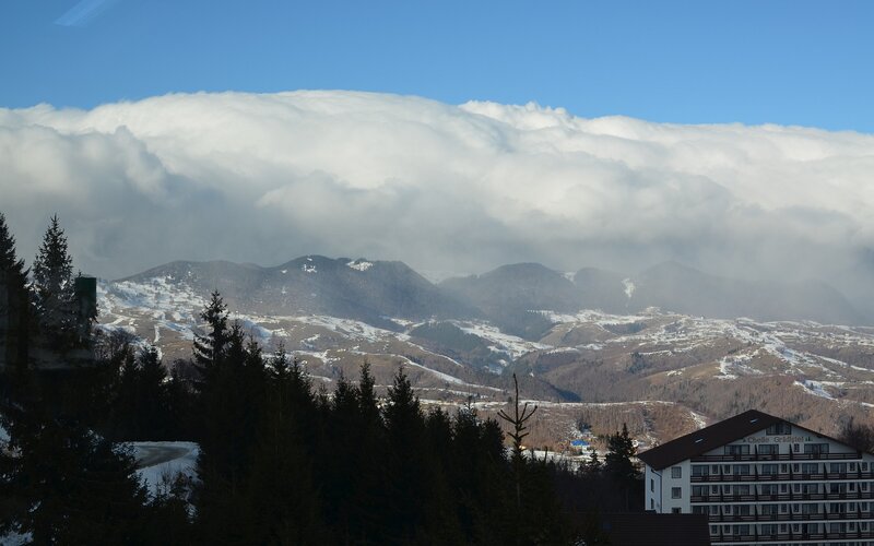 Mountain resort under cloudy sky