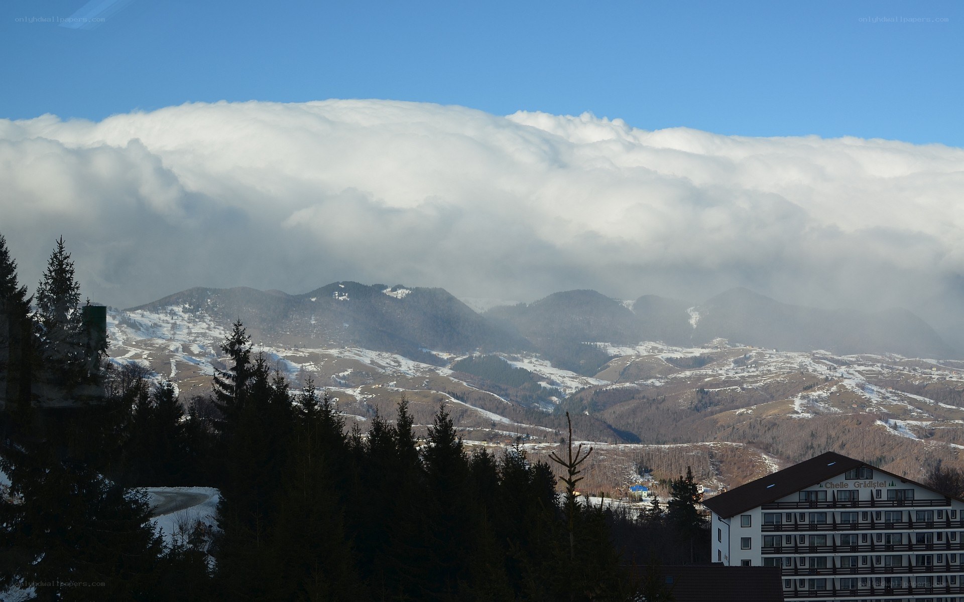 Mountain resort under cloudy sky