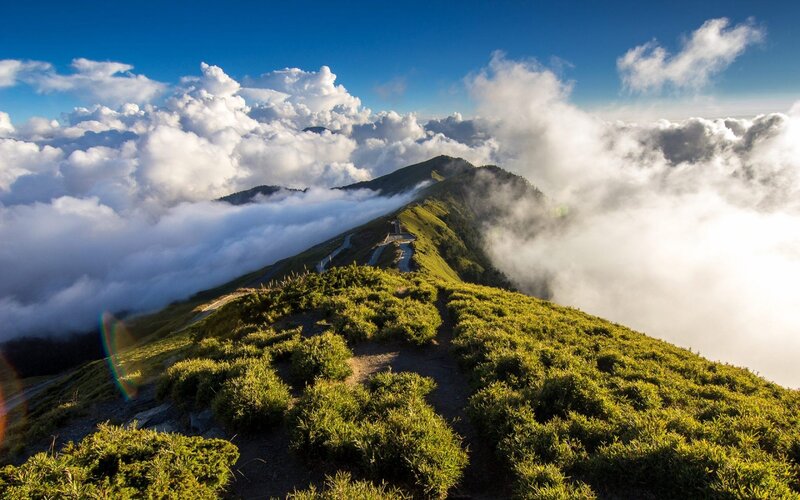 Mountain Ridge Above Clouds — Green, Serene, Morning