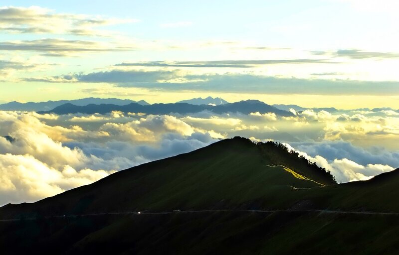 Mountain Ridge Above Clouds — Green, Serene, Sunrise
