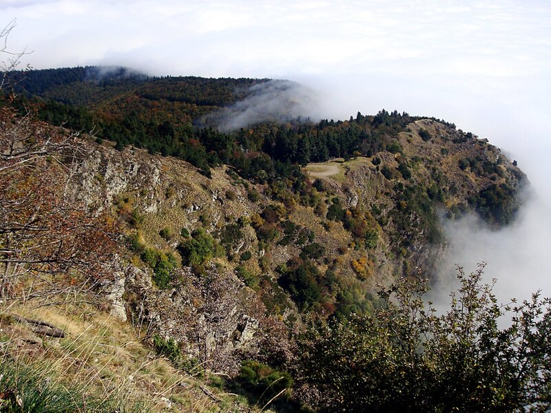 Mountain ridge above clouds