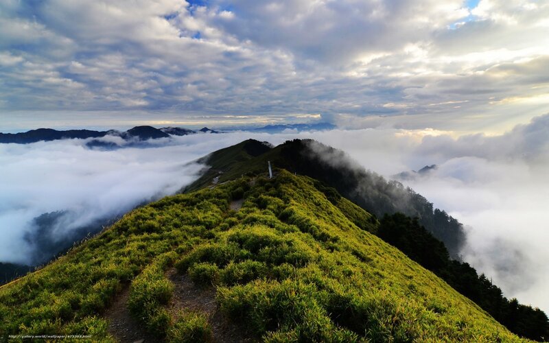 Mountain ridge above the clouds
