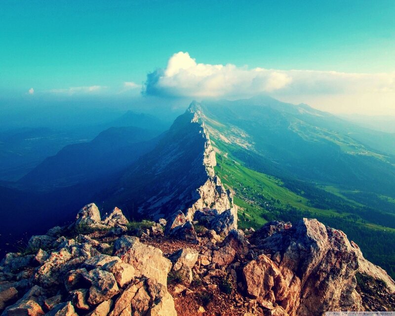 Mountain ridge under blue sky