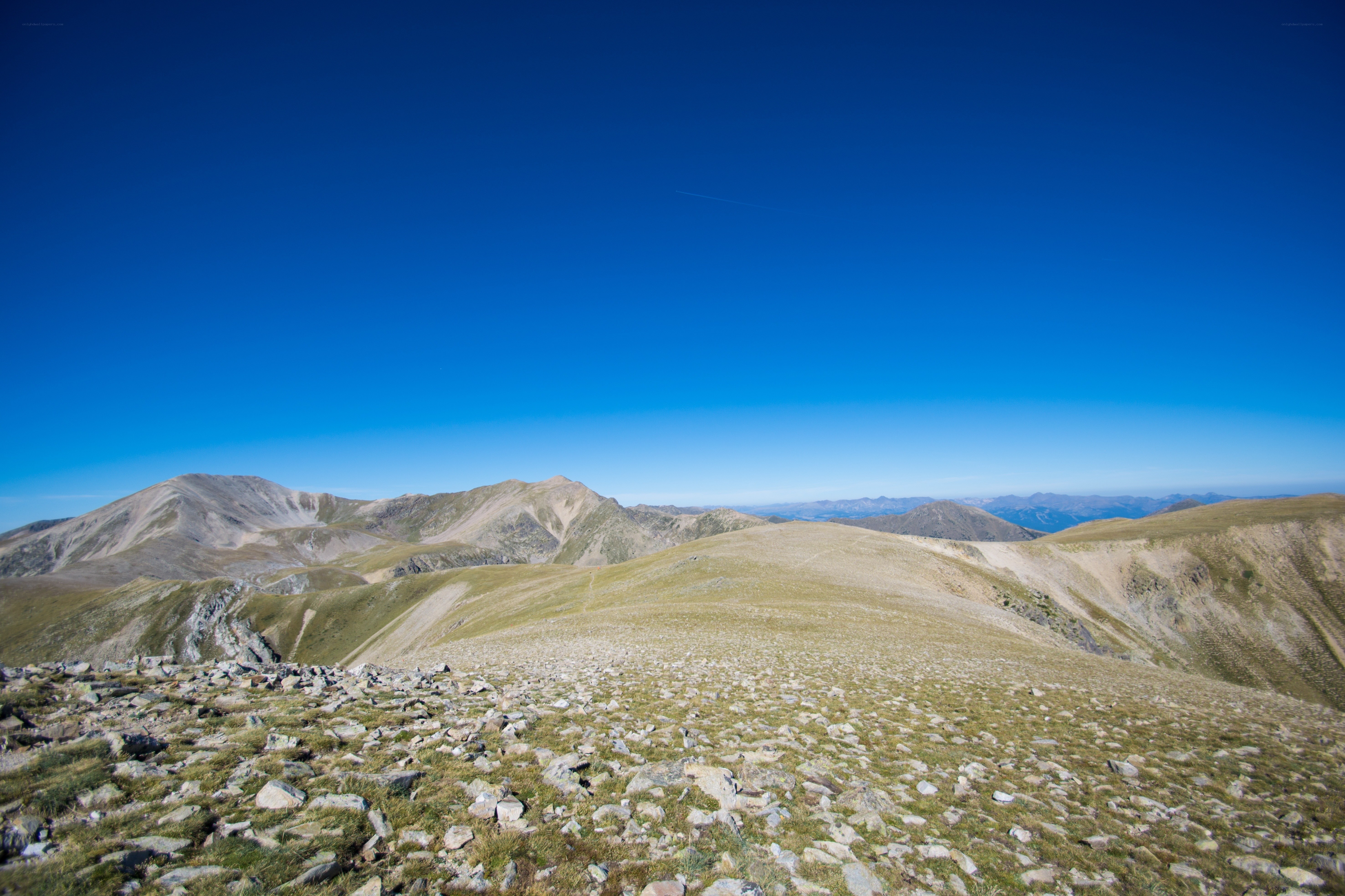 Mountain ridge under clear blue sky