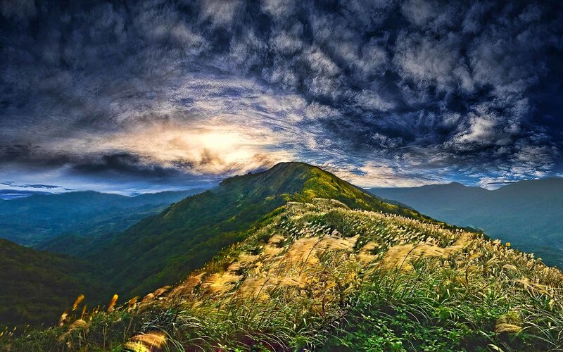 Mountain Ridge under Stormy Sky