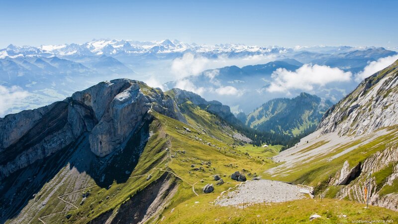 Mountain Ridge with Snow-capped Peaks — Blue