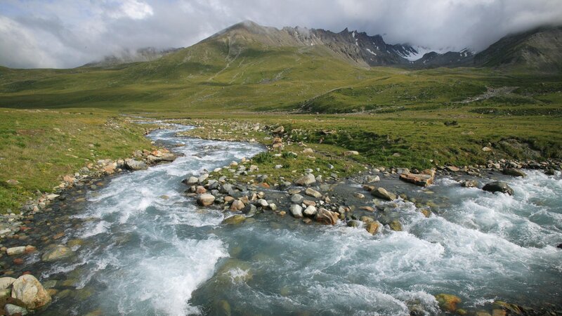 Mountain river flowing through valley