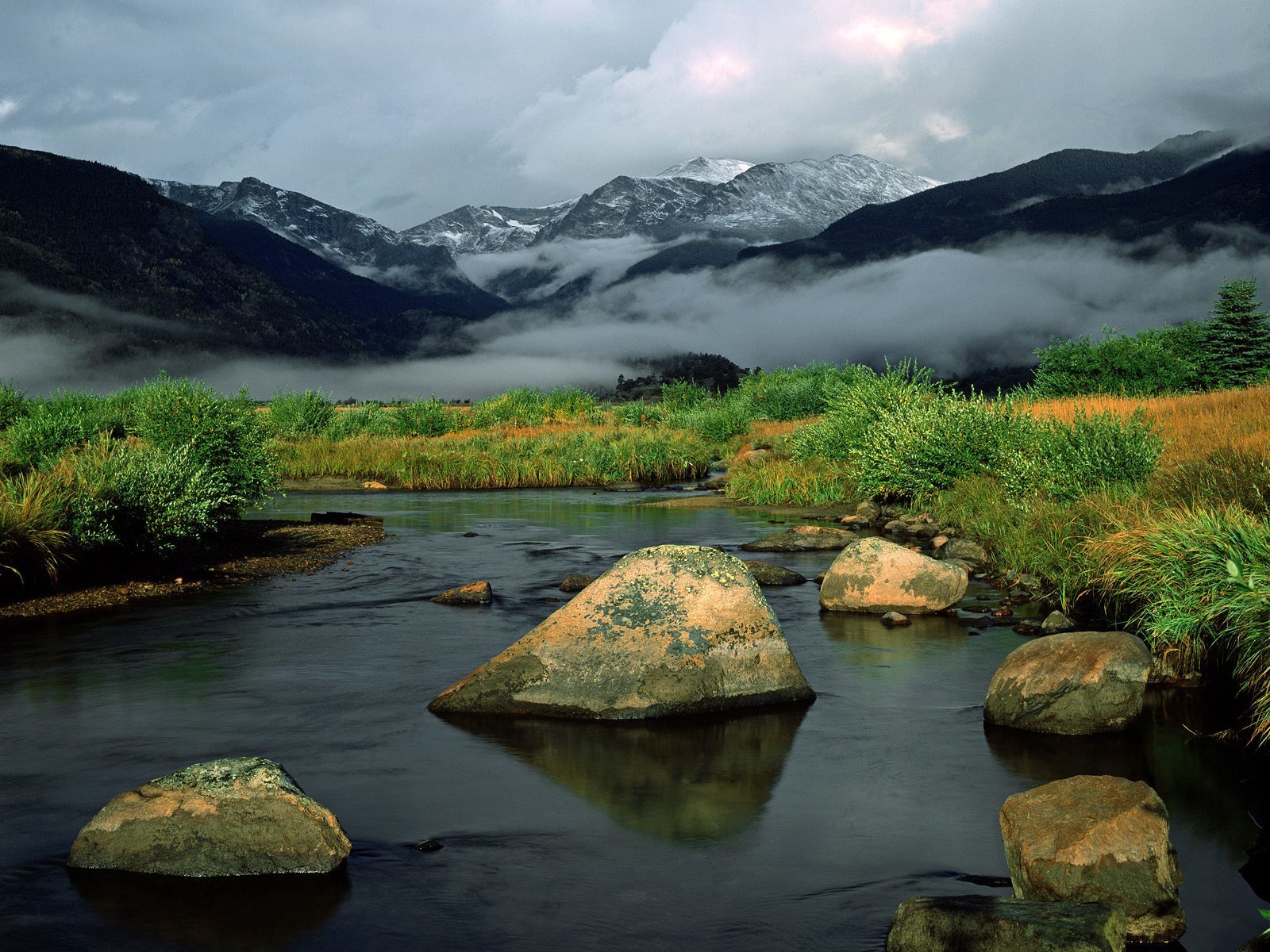 Mountain river with snow-capped peaks