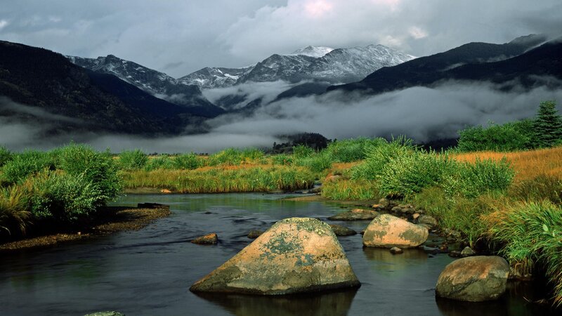 Mountain river with snow-capped peaks