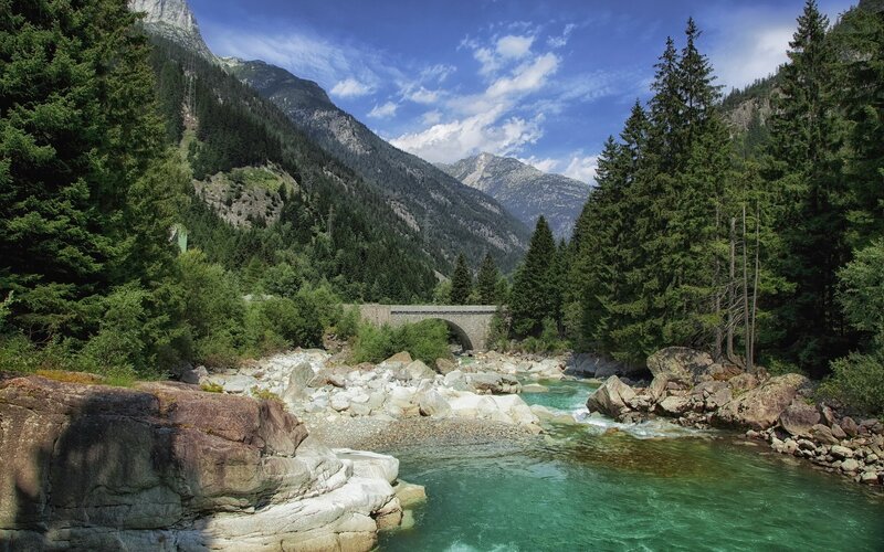 Mountain river with stone bridge