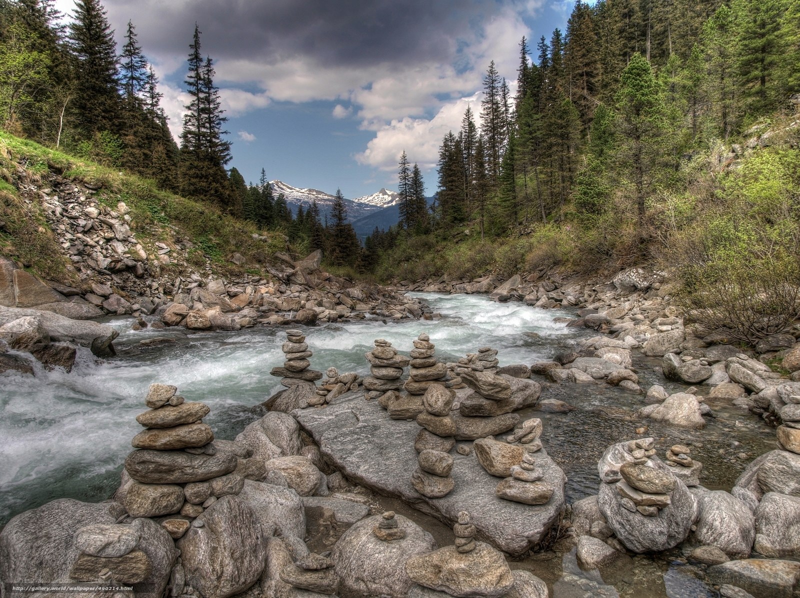 Mountain river with stone cairns