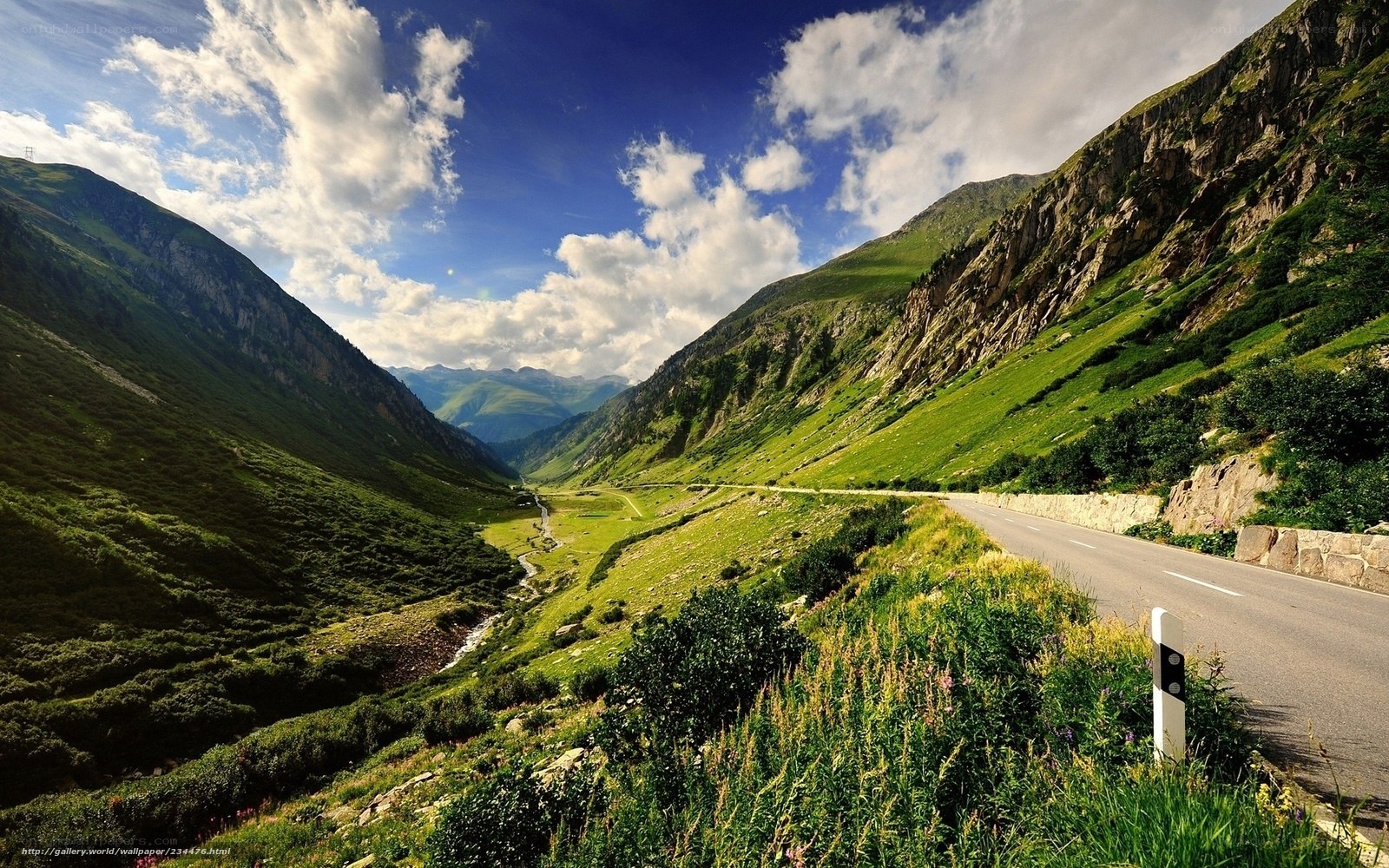 Mountain road in a green valley