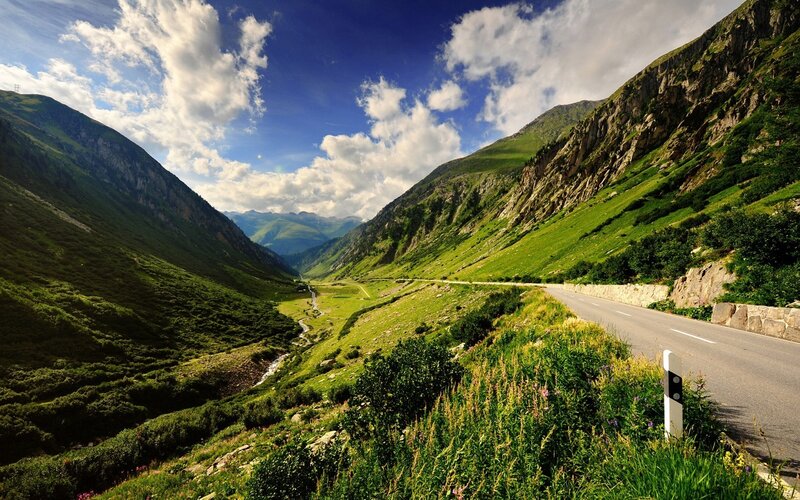 Mountain road in a green valley