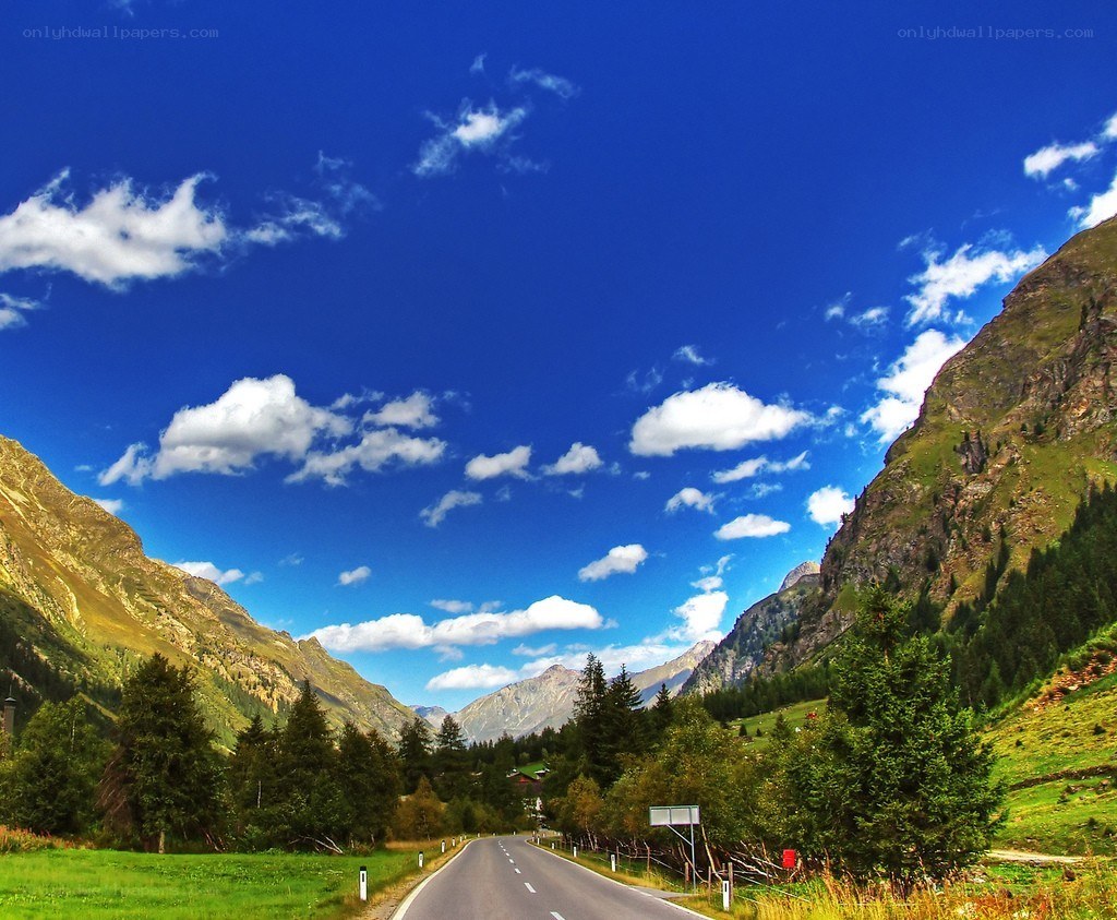 Mountain road under blue sky