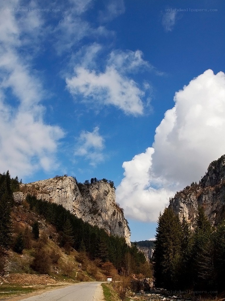 Mountain road under blue sky