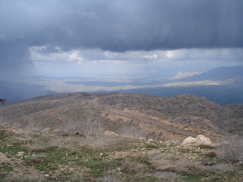 Mountain Road under Storm Clouds