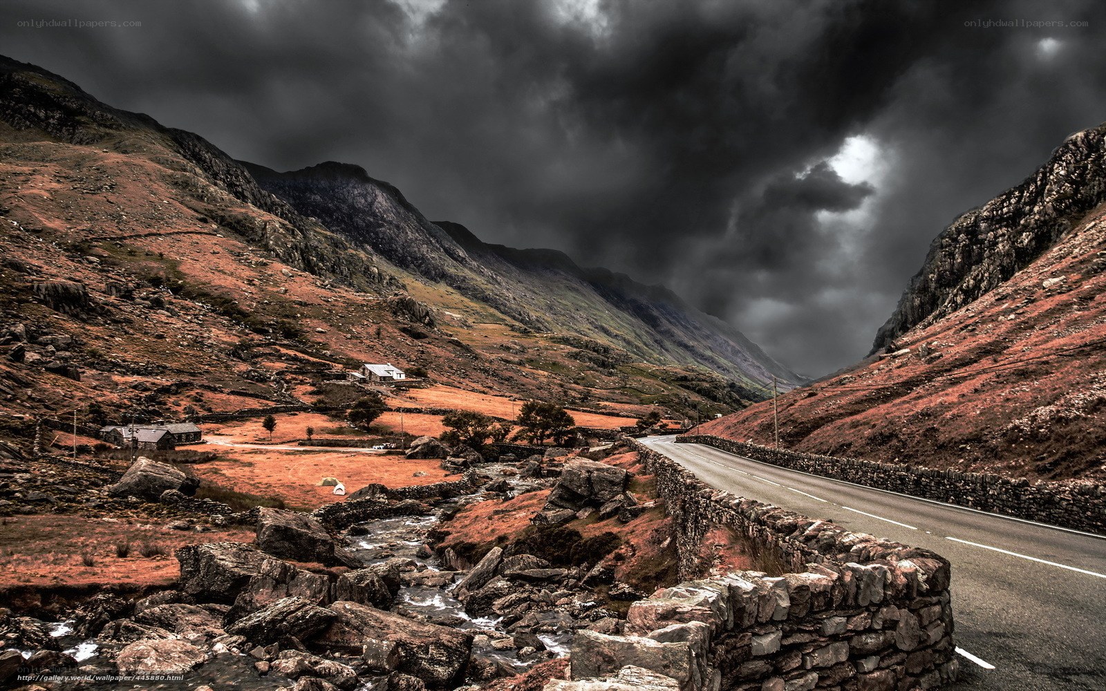 Mountain road under stormy sky