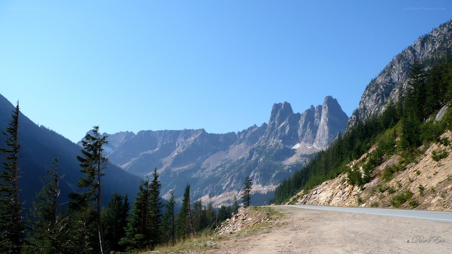 Mountain road with jagged peaks