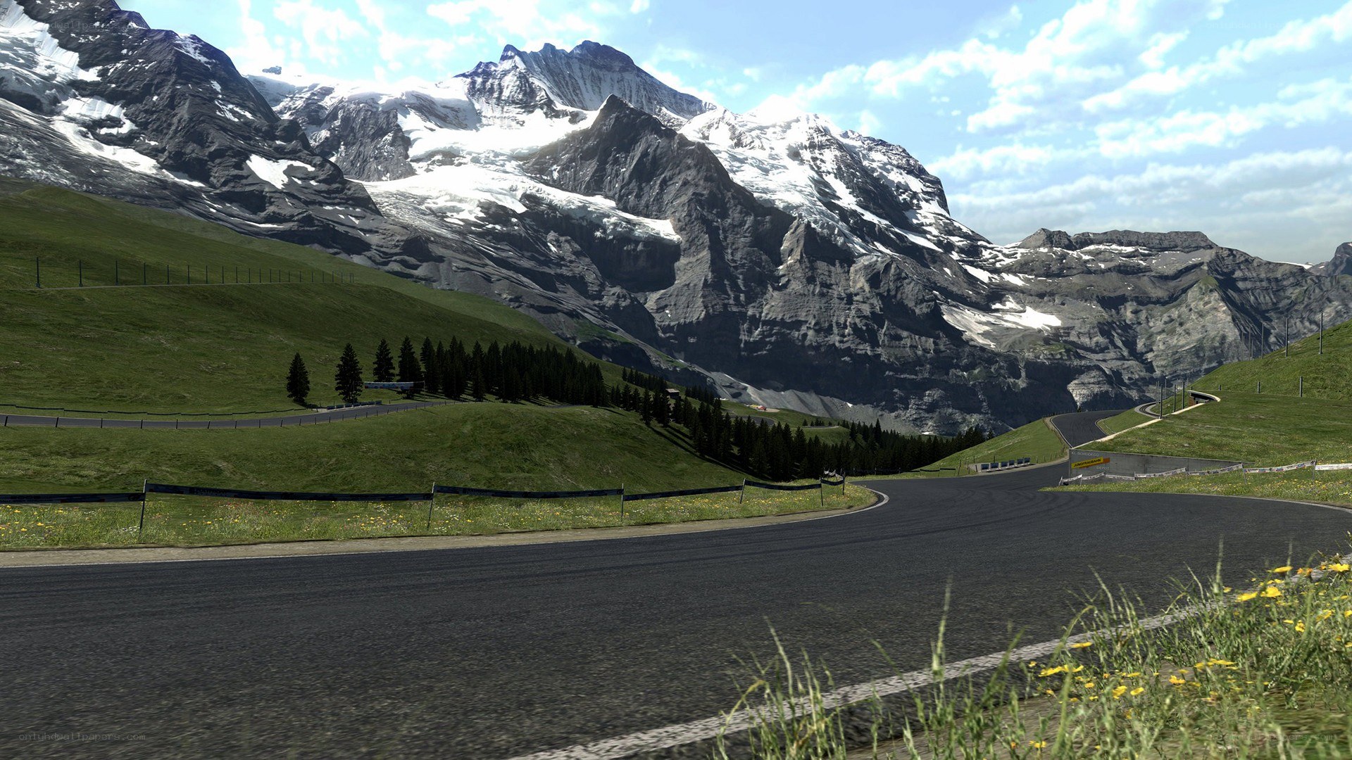 Mountain road with snow-capped peaks