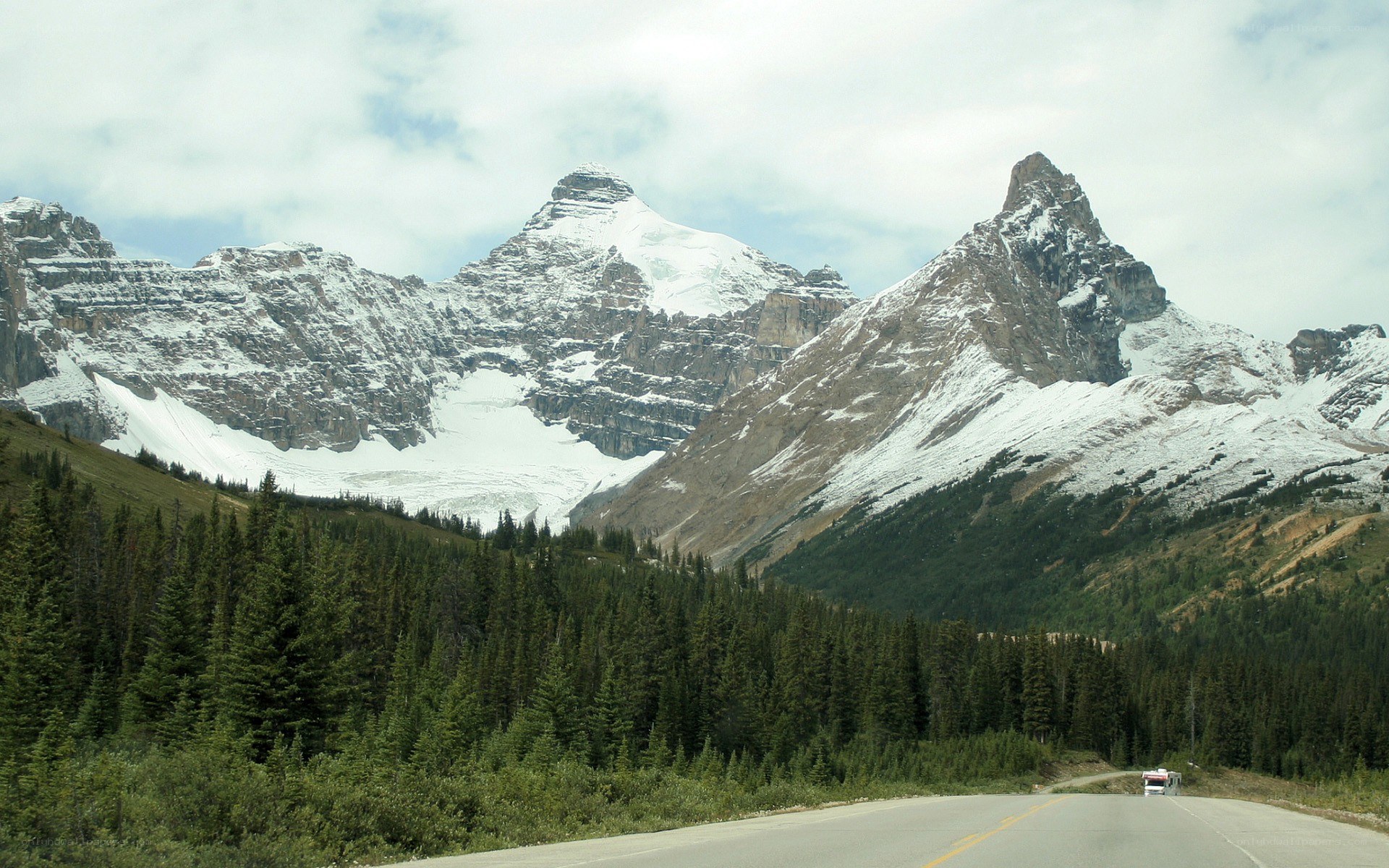 Mountain road with snow-capped peaks