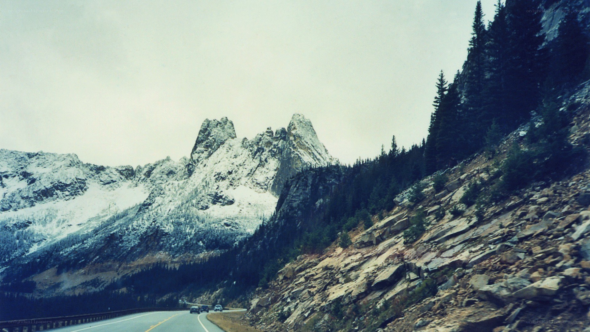 Mountain road with snow-capped peaks