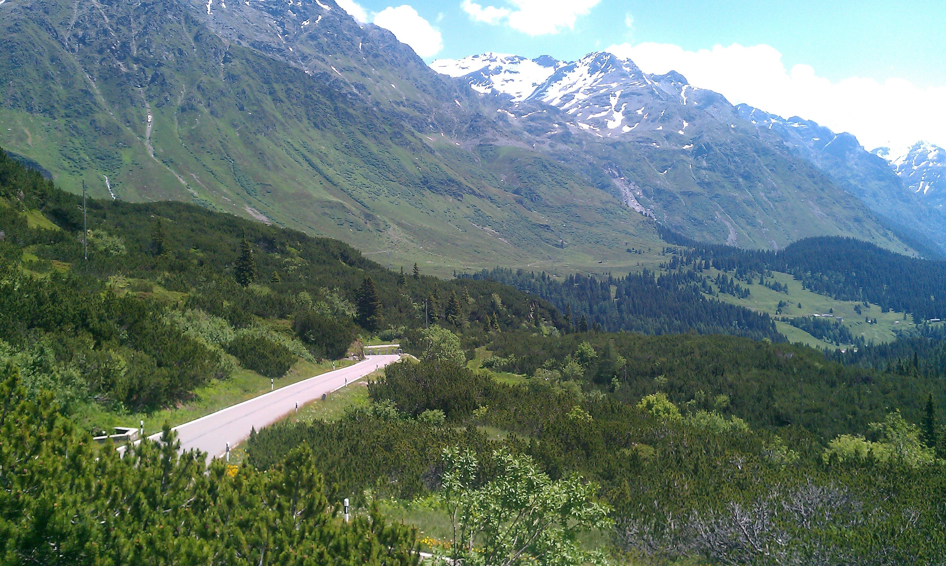 Mountain road with snow-capped peaks