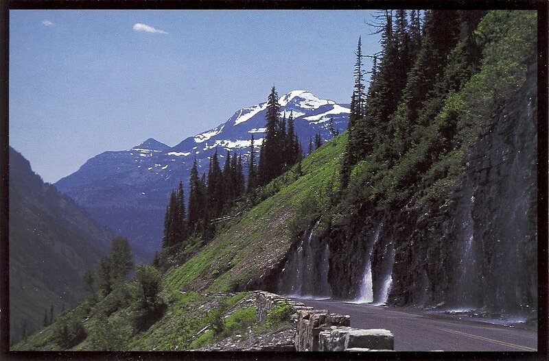 mountain road with waterfalls