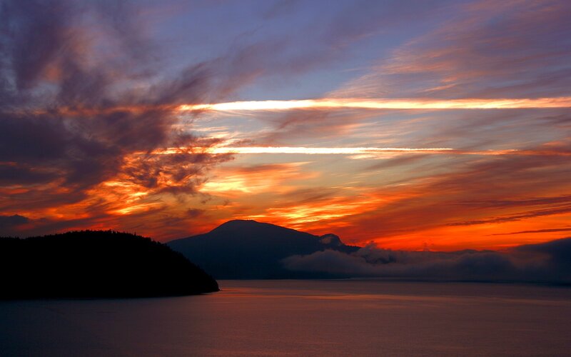 Mountain Silhouette at Sunset — Orange, Dramatic, Photograph, Mountains, Water, Clouds