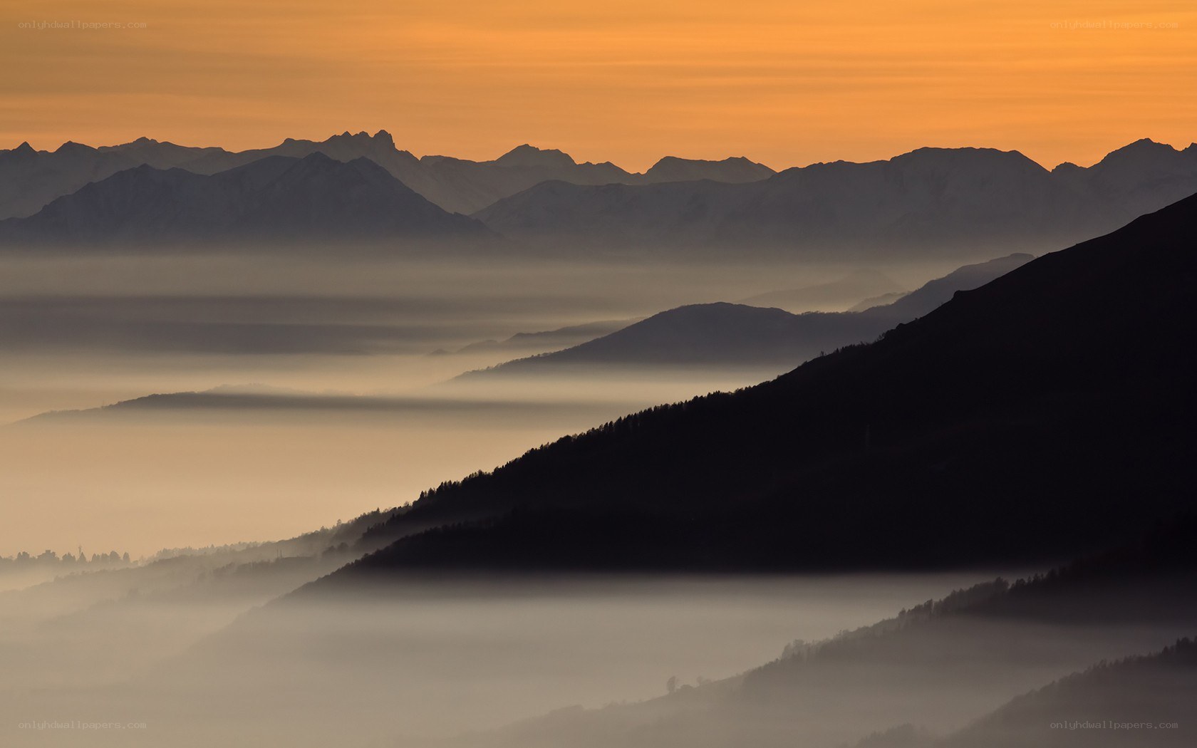 Mountain silhouettes at sunrise