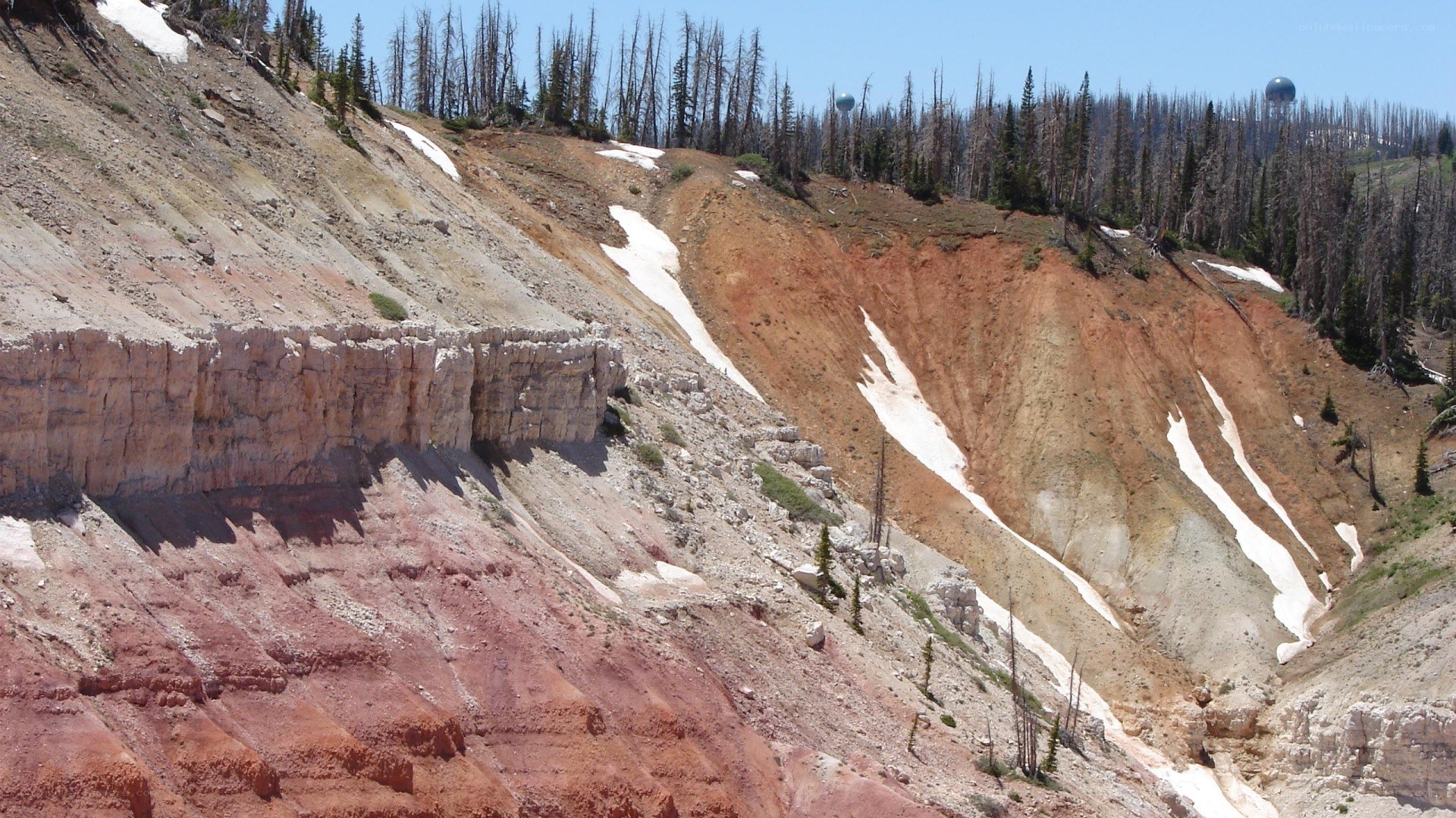 mountain slope with snow patches
