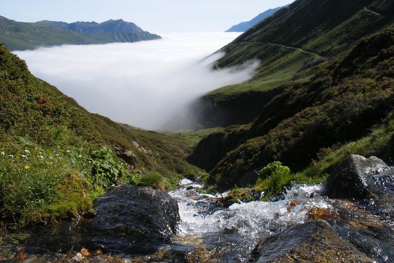 Mountain stream above the clouds