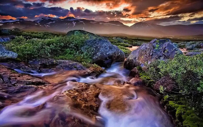 Mountain stream at sunset