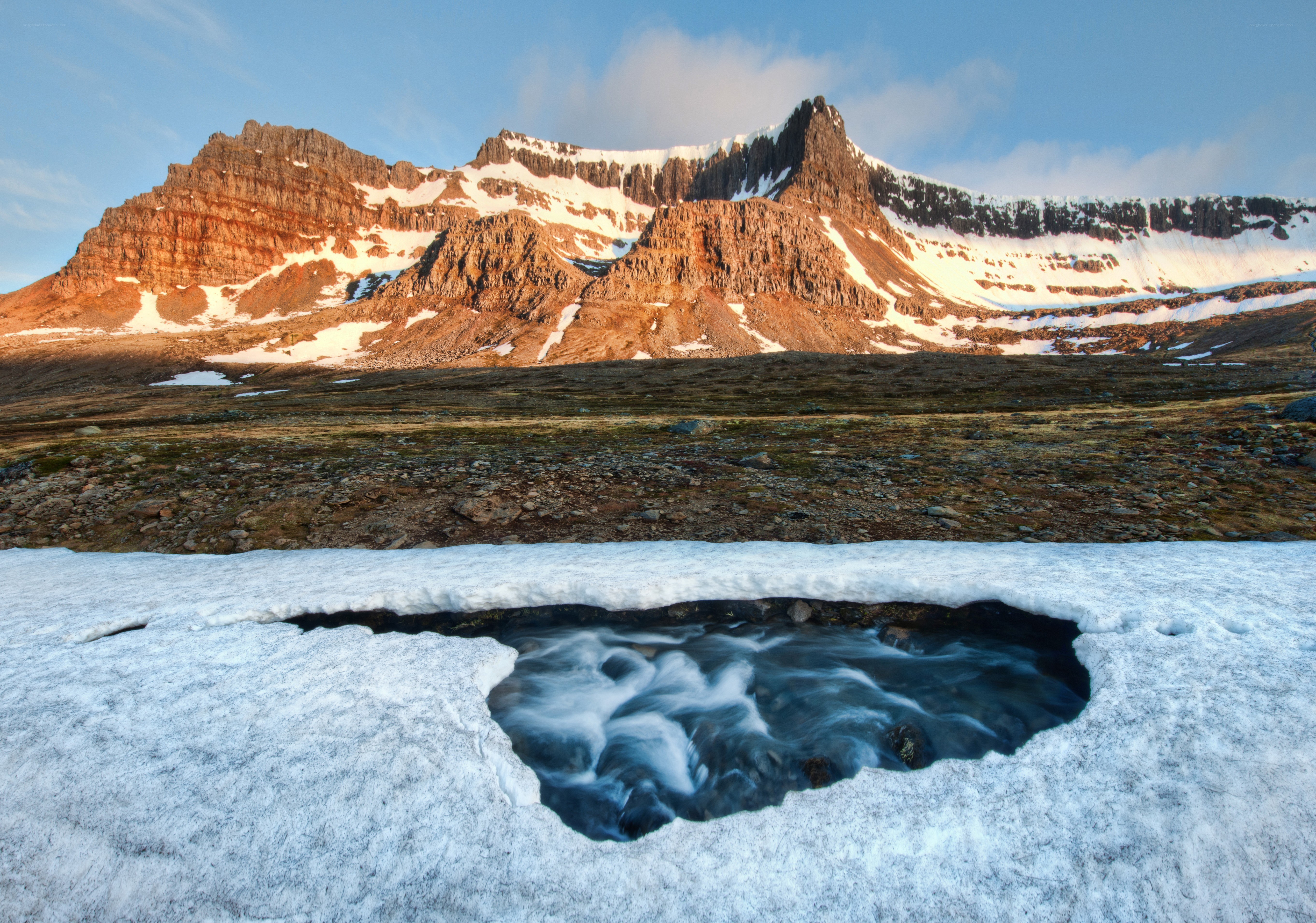 Mountain stream in snow