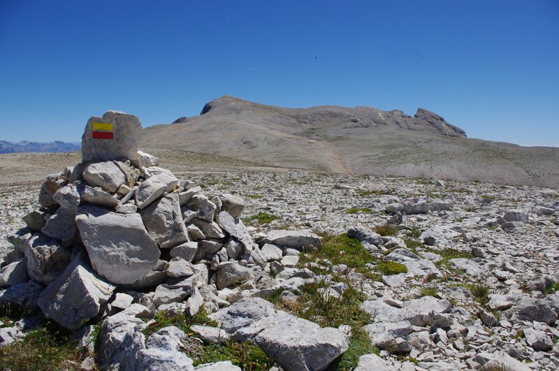 Mountain summit with trail marker