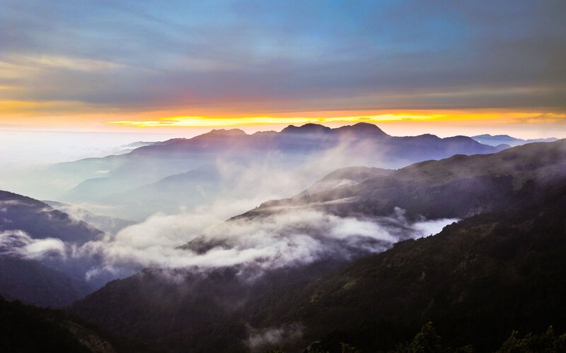 Mountain sunrise with clouds