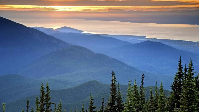 Mountain sunset over a coastal valley