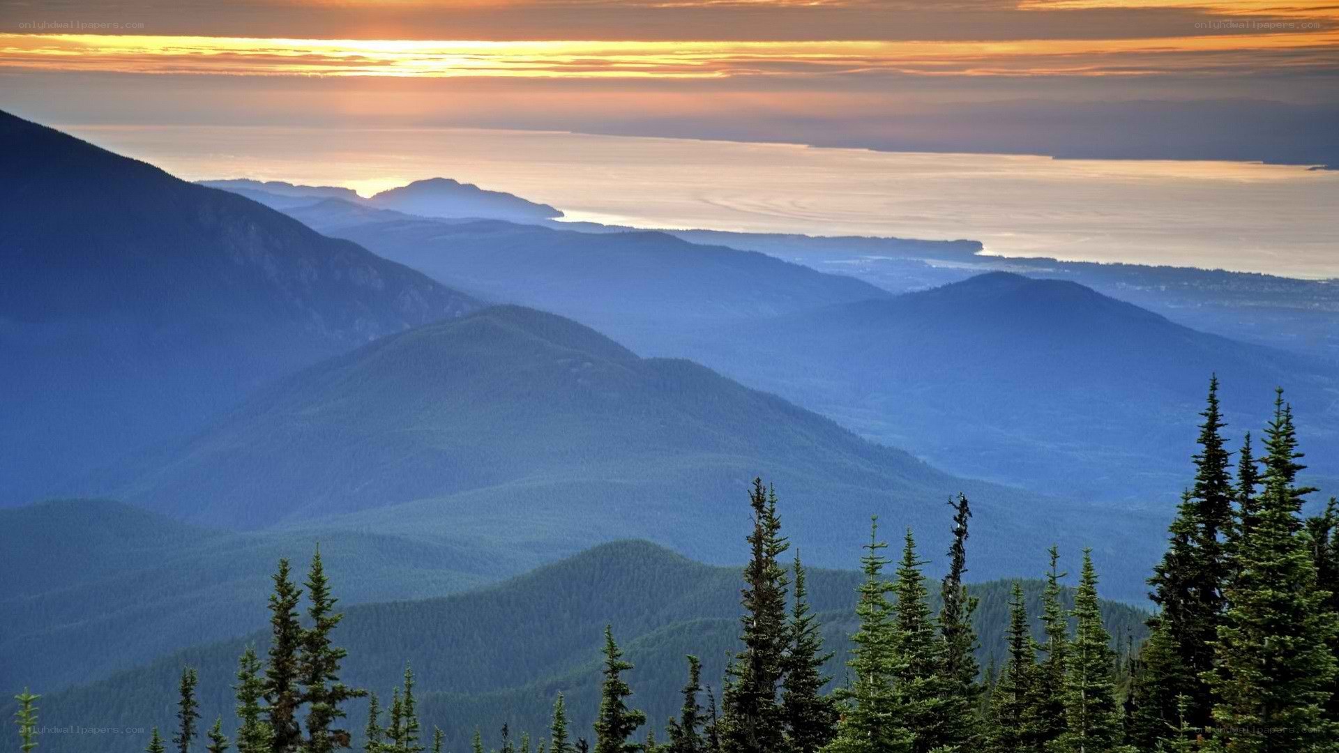 Mountain sunset over a coastal valley