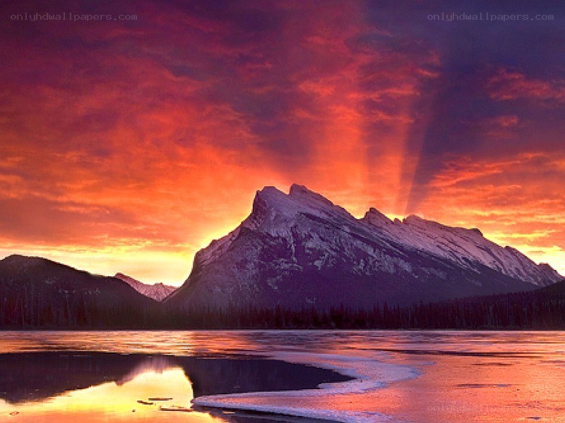 Mountain sunset over a lake