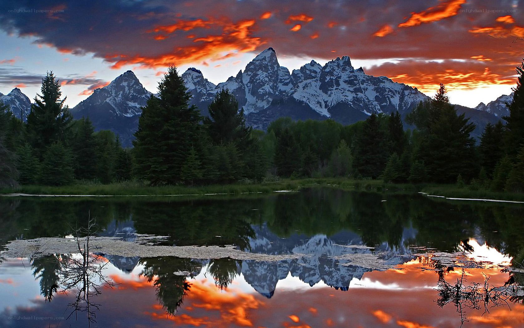 Mountain sunset over a lake