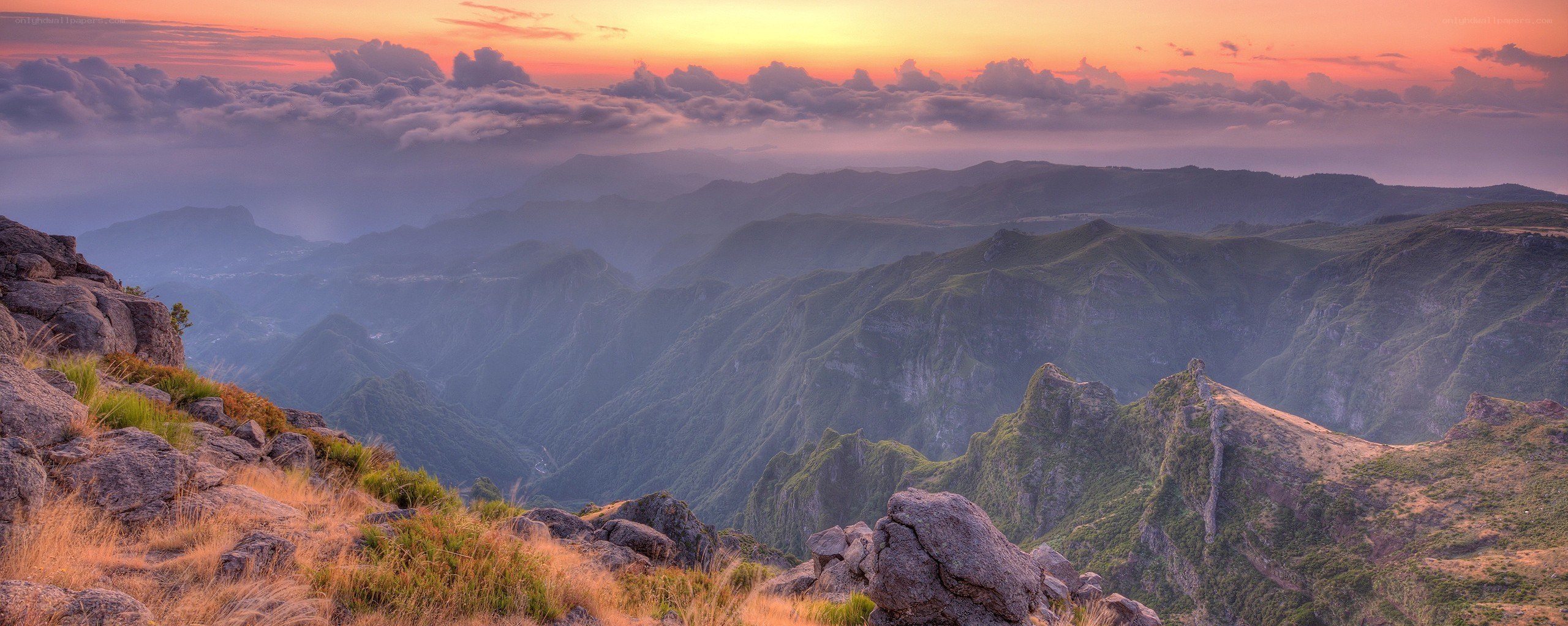 Mountain sunset over a valley
