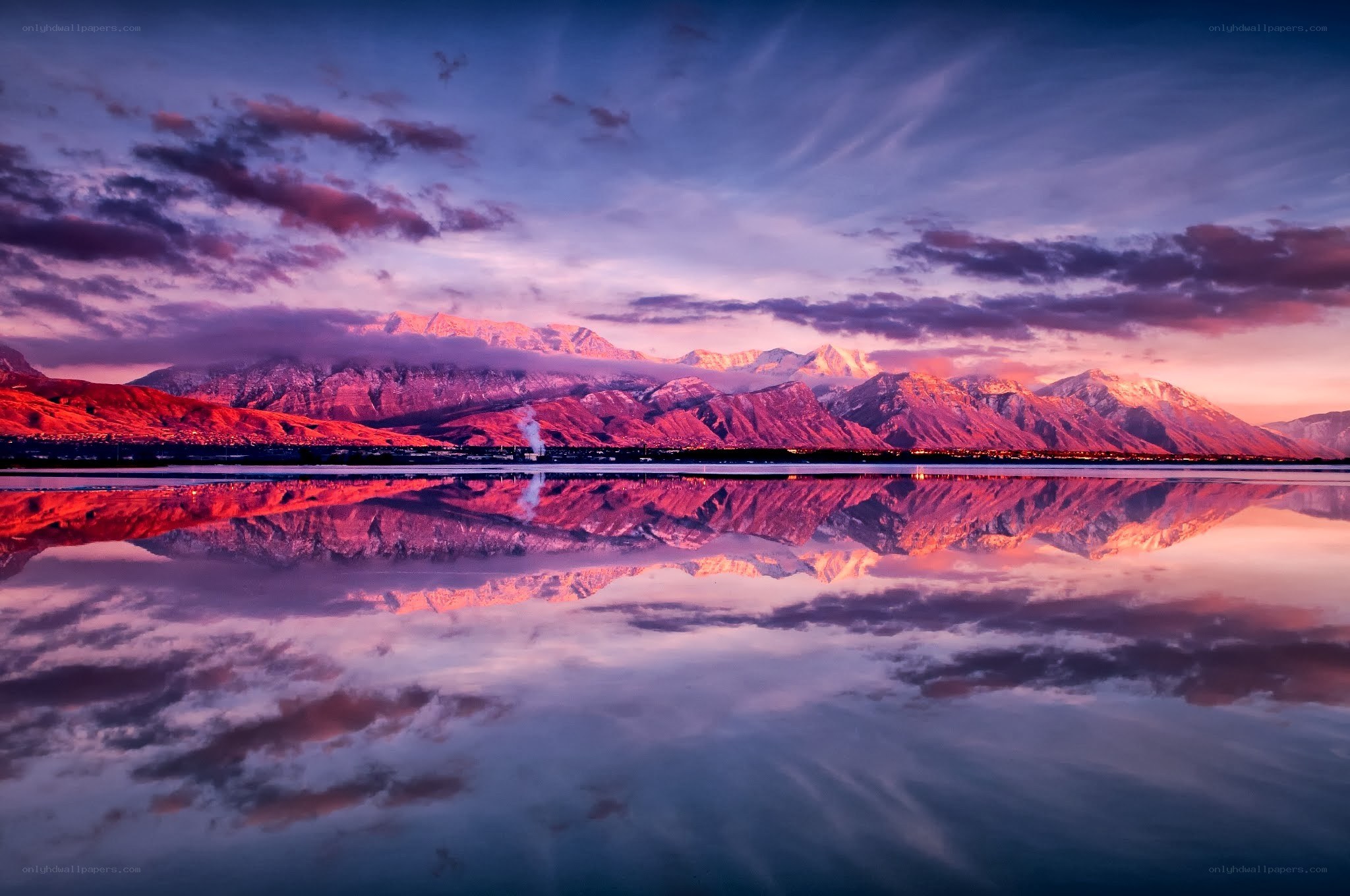 Mountain sunset over calm lake