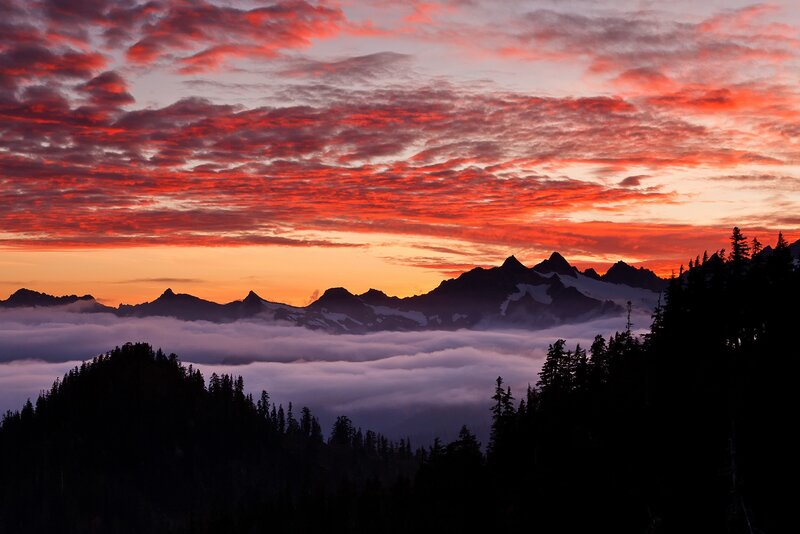 Mountain sunset over cloud sea