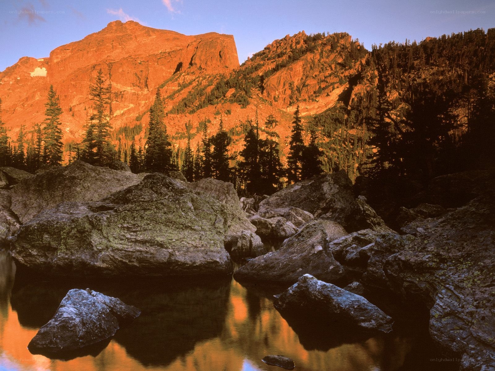 Mountain sunset over lake