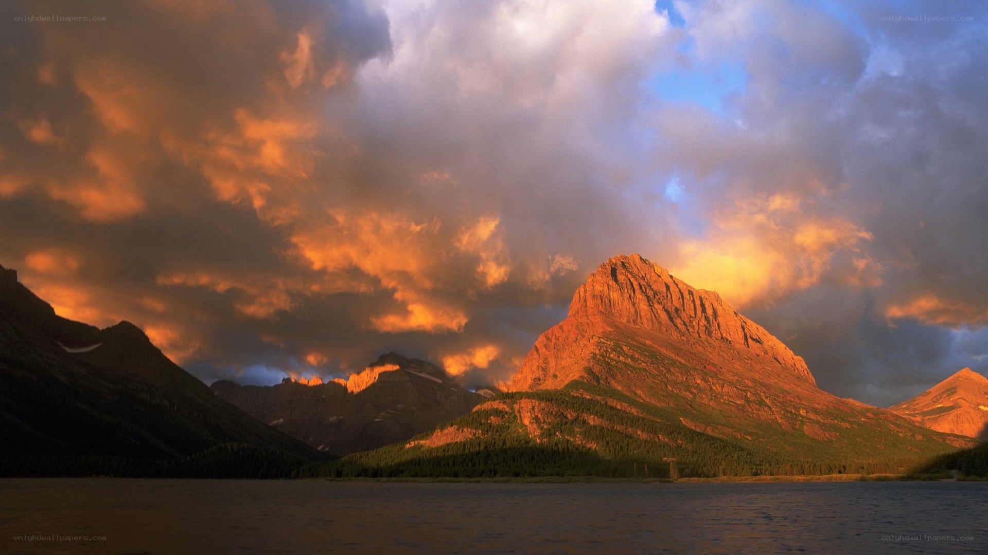 Mountain sunset over lake