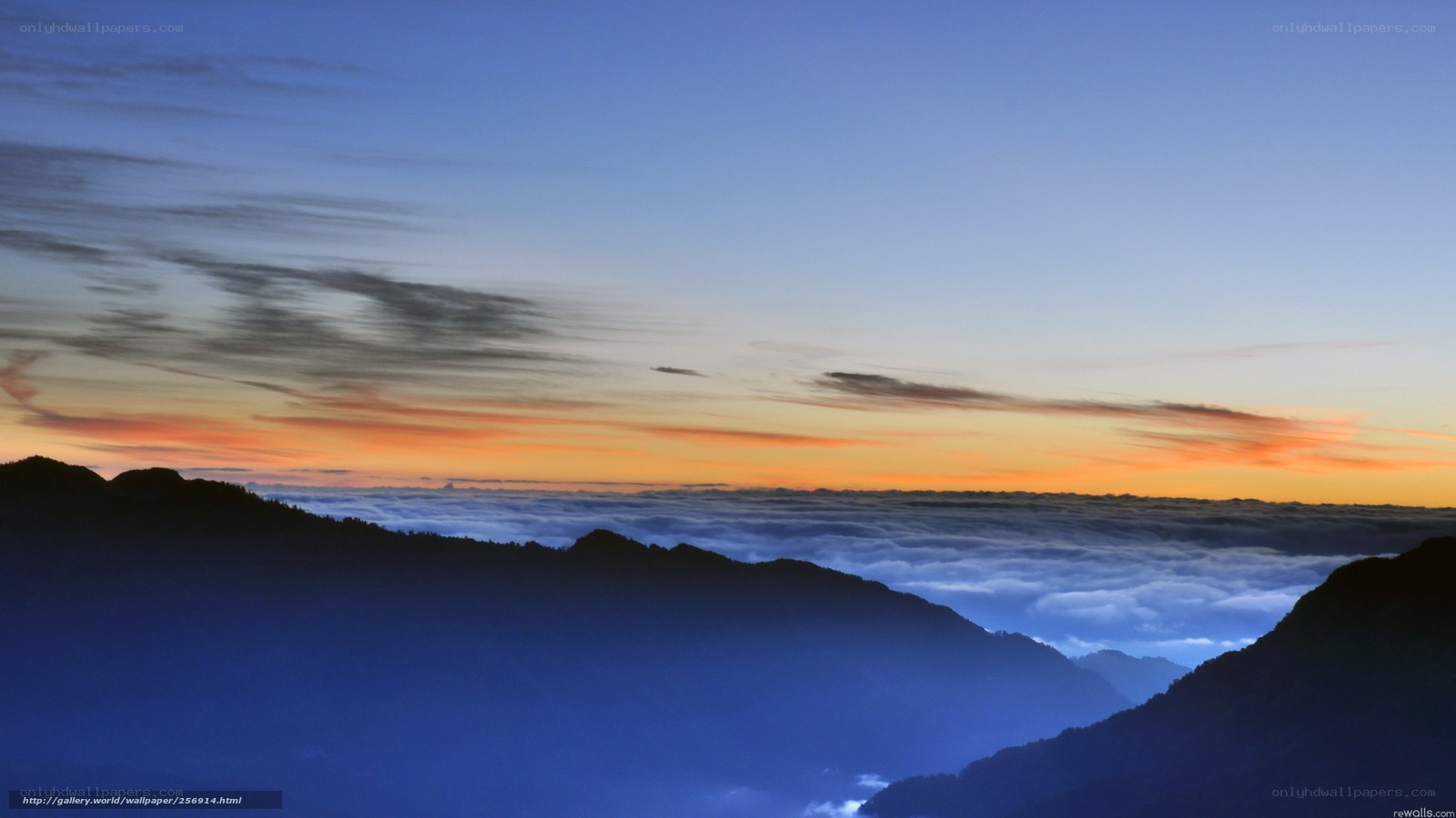 Mountain sunset over sea of clouds
