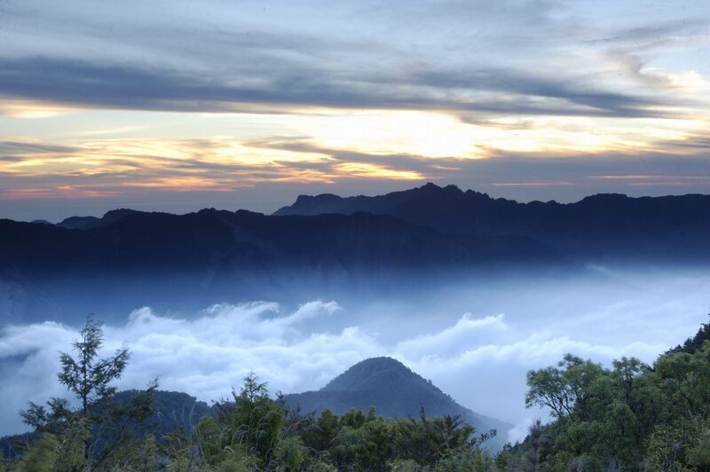 Mountain sunset over sea of clouds
