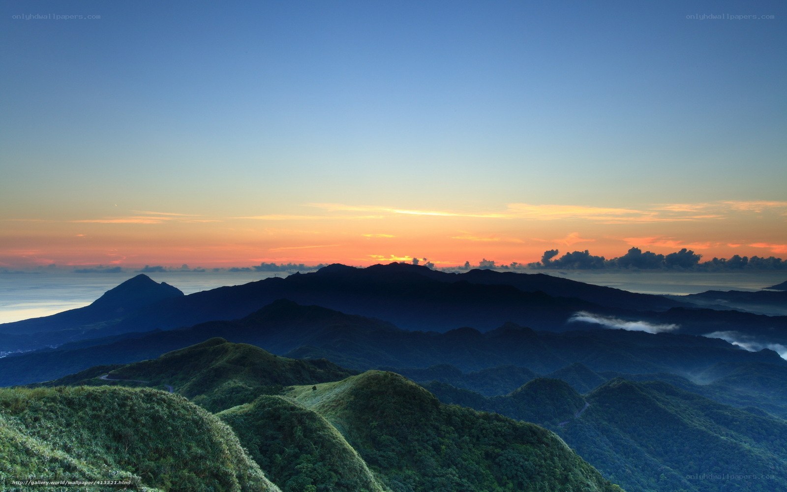 Mountain sunset over the sea