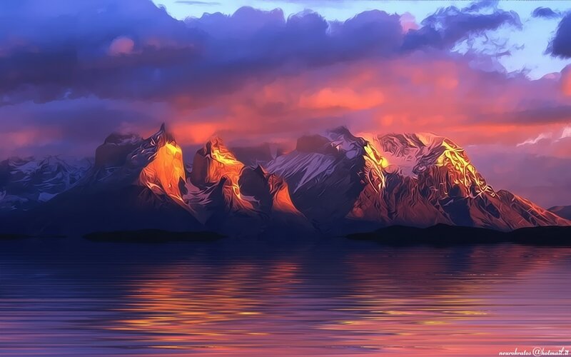 mountain sunset over water